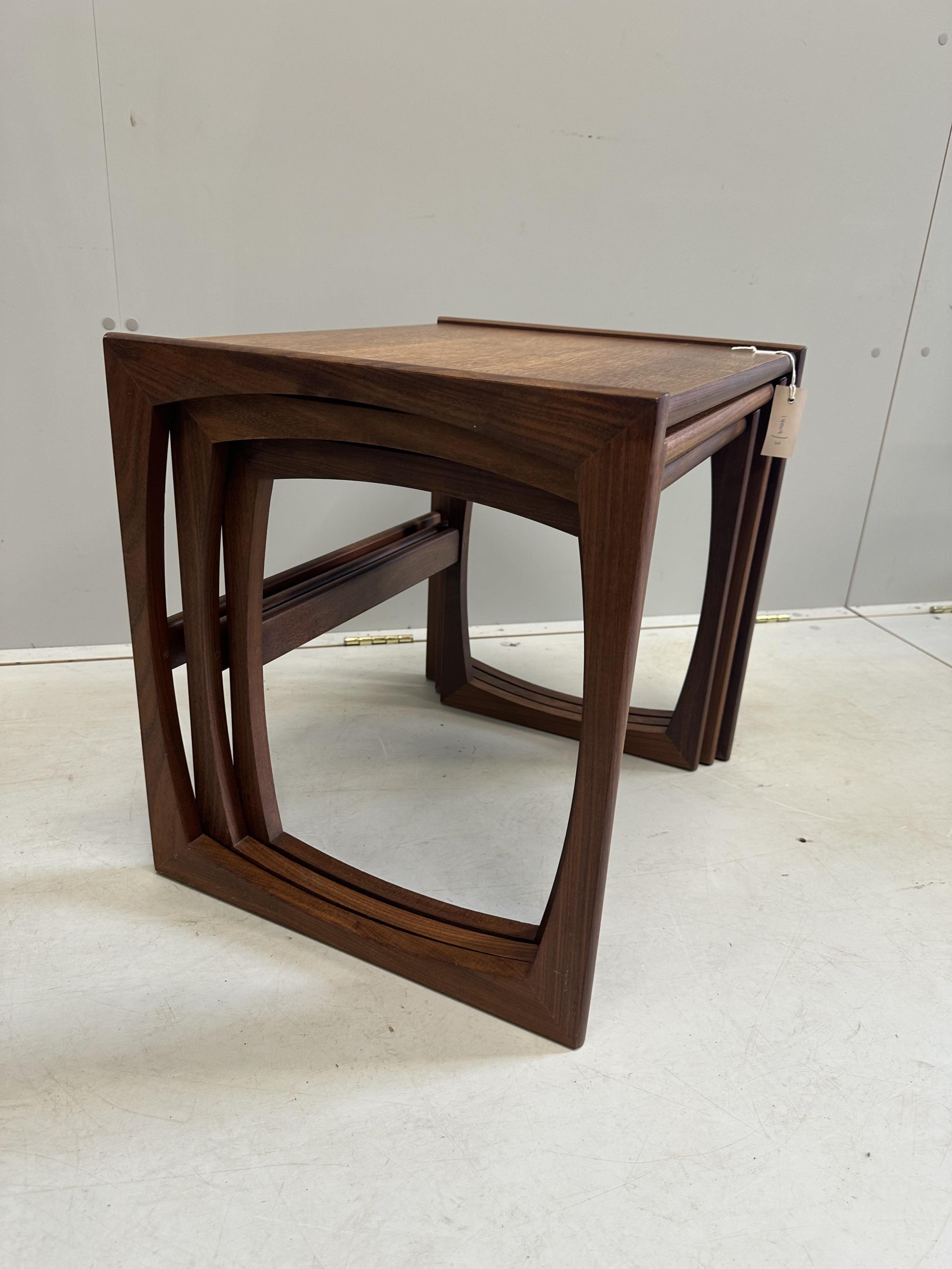 A nest of three mid century G Plan teak tea tables, width 53cm, depth 43cm, height 49cm. Condition - fair